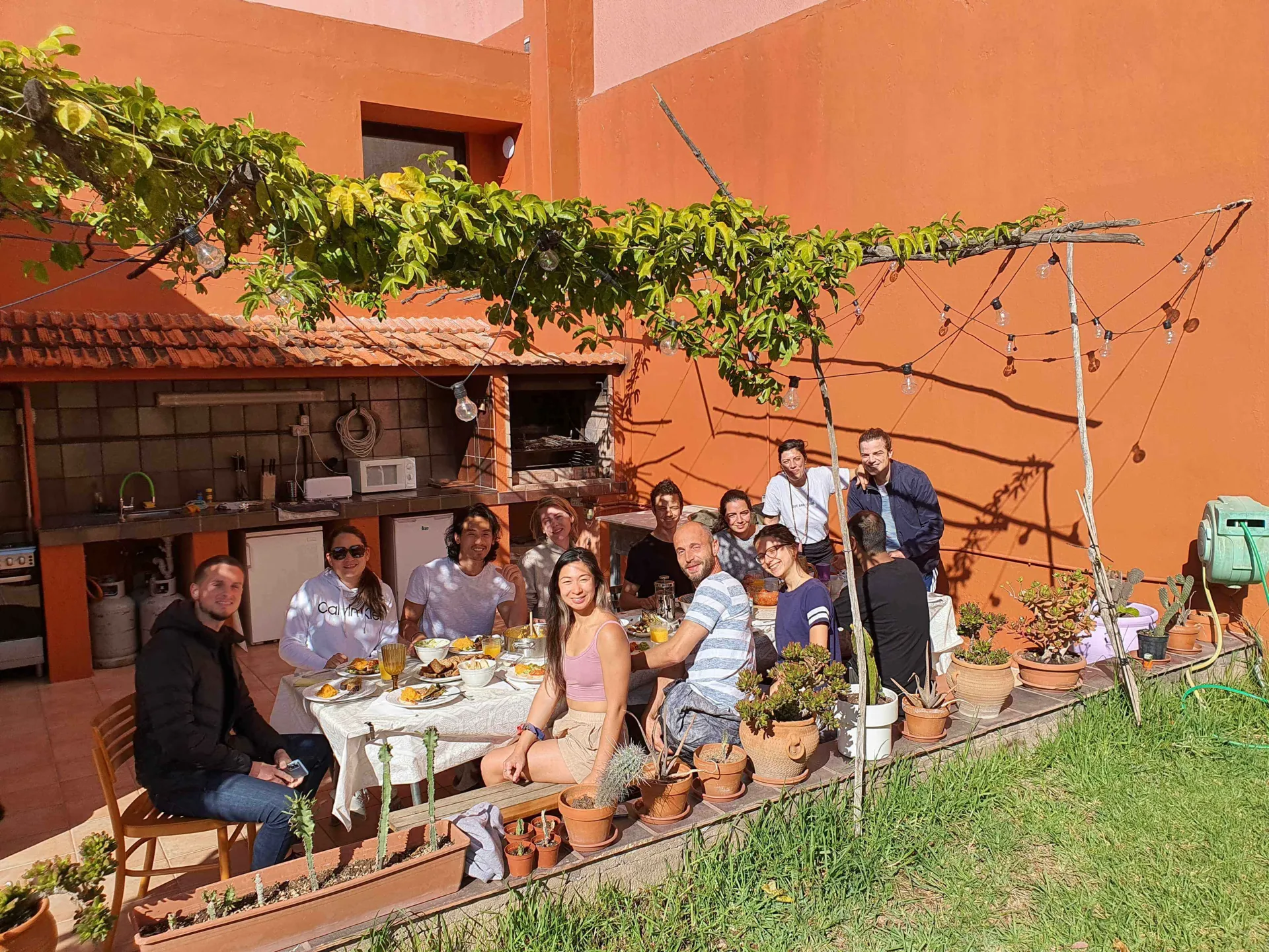 Colivers sharing lunch on the patio at Cactus Coliving in Tenerife