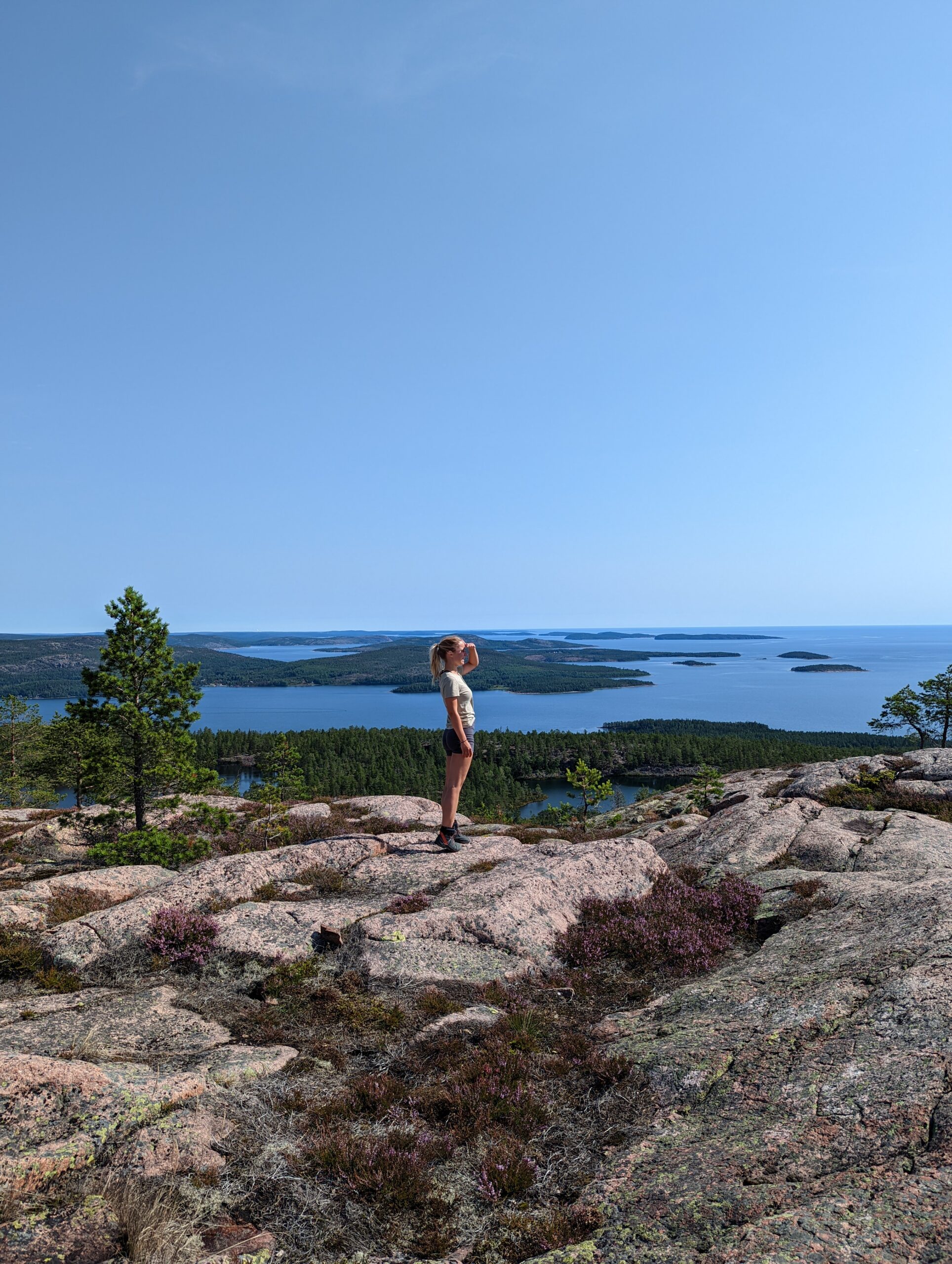 Sarah, founder of Northliving, hiking above the High Coast archipelago